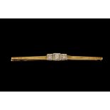 A DIAMOND BAR BROOCH,