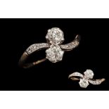 AN ANTIQUE DIAMOND MOI ET TOI RING,