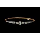 A LATE VICTORIAN DIAMOND BANGLE, set with old cut diamonds of approx. 1.