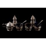 A PRE-WAR SET OF SIX SILVER CONDIMENTS, Birmingham 1932, cased,