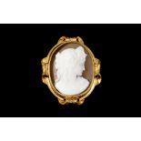 AN OVAL SHELL CAMEO BROOCH, in 15ct gold frame mount.