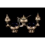 A GEORGE V SILVER FIVE PIECE CONDIMENT SET, with applied Celtic decoration,
