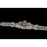 A DIAMOND COCKTAIL BRACELET CIRCA 1930'S, mounted in platinum,