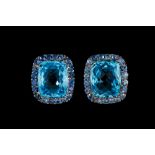 A PAIR OF TOPAZ AND TANZANITE CLUSTER EARRINGS, mounted in white gold,