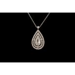 A PEAR SHAPED DIAMOND CLUSTER PENDANT, with central pear shaped diamond of approx. 0.