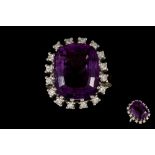 AN AMETHYST AND DIAMOND CLUSTER RING, with amethyst of approx. 14.00ct, diamonds of approx. 0.