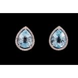 A PAIR OF PEAR SHAPED DIAMOND AND TOPAZ CLUSTER EARRINGS,