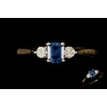 A SAPPHIRE AND DIAMOND THREE STONE RING,