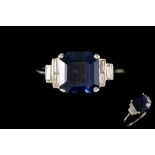 A SAPPHIRE AND DIAMOND DRESS RING, with one octagonal step cut sapphire of 4.