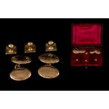 A PAIR OF ANTIQUE 9CT GOLD CUFFLINKS, with engraved decoration, in fitted case,