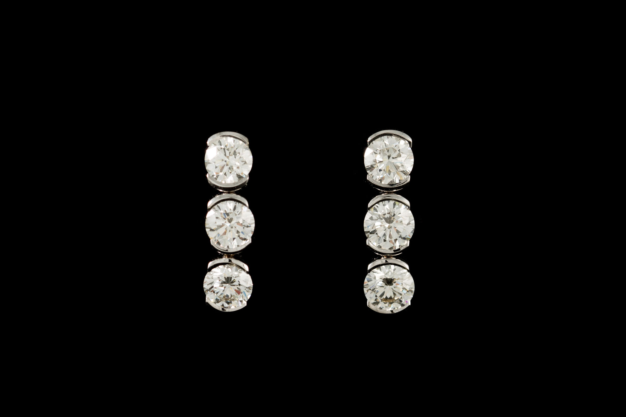 A PAIR OF DIAMOND EARRINGS BY THEO FENNELL, with diamonds of approx. 2.