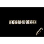 A DIAMOND ETERNITY RING,