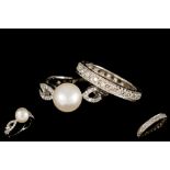 A PEARL AND DIAMOND DRESS RING,