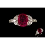 A RUBY AND DIAMOND RING, one cushion cut ruby of 2.