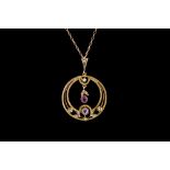 AN ART NOUVEAU AMETHYST AND PEARL CIRCULAR PENDANT, mounted in gold,