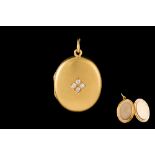 A 15CT GOLD OVAL LOCKET, set with diamonds of approx 0.16ct total.