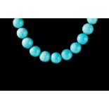 A TURQUOISE BEAD NECKLACE, with twenty nine turquoise beads from 15.9mm to 16.