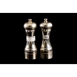 A PAIR OF SILVER PEPPER MILLS,