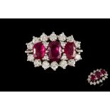 A RUBY AND DIAMOND TRIPLE CLUSTER RING, with rubies of approx. 2.56ct and diamonds of approx. 0.