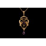 AN ART NOUVEAU AMETHYST AND SEED PEARL PENDANT,