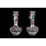 A PAIR OF 20TH CENTURY CONTINENTAL POLYCHROME VASES, with applied figures and floral decoration,
