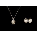 A PAIR OF PEARL AND DIAMOND EARRINGS,