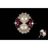 A RUBY DIAMOND AND CULTURED PEARL DRESS RING, mounted in 14ct white gold.