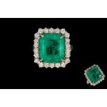 AN EMERALD AND DIAMOND RING, with IGI report stating the emerald cut Columbian emerald to be 9.