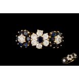 A SAPPHIRE AND DIAMOND FLORAL CLUSTER DRESS RING,