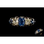 A FIVE STONE DIAMOND AND SAPPHIRE RING, set with old cut stones of approx. 0.