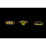 THREE PERIDOT RINGS,