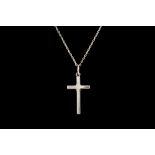 A WHITE GOLD CROSS,