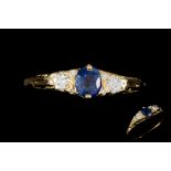 A SAPPHIRE AND DIAMOND THREE STONE RING,