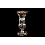 AN EDWARDIAN SILVER FLARED VASE, of baluster form, with swirling ancantus leaf decoration, 9" high,