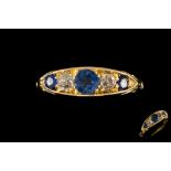 A SAPPHIRE AND DIAMOND CARVED DRESS RING, with sapphires of approx. 0.64ct and diamonds of approx.