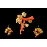 A CORAL BRANCH BROOCH AND EARRINGS SET, in yellow gold leaf style mounts,