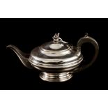 A GEORGE V SILVER TEAPOT, of low plain form, by West & Son, (Dublin),