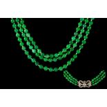 A THREE ROW JADE BEAD NECKLACE,