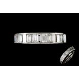 A DIAMOND FULL ETERNITY RING IN PLATINUM BY CARTIER,