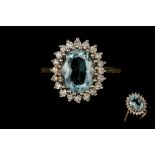 AN AQUAMARINE AND DIAMOND CLUSTER RING,