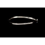 AN 18CT GOLD BANGLE,