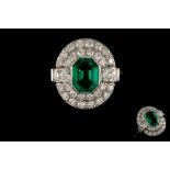 AN EMERALD AND DIAMOND CLUSTER RING, one octagonal step cut emerald of 1.