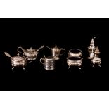 A COLLECTION OF SILVER HALLMARKED CONDIMENTS, comprising of four mustard pots and spoons,