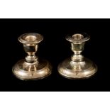 A PAIR OF EDWARDIAN SILVER CHAMBER CANDLESTICKS, Chester 1909, cased, retailed by Weir & Sons,
