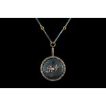 AN ENAMEL AND DIAMOND LOCKET BY FABERGÉ, a round locket with blue guilloche enamel,