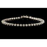 A DIAMOND LINE BRACELET, mounted in 18ct white gold, with diamonds of approx. 3.00ct.