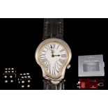 A 'DALI' WRIST WATCH, boxed; together with Victorinox Swiss army pen knife set,