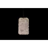 A WHITE JADEITE PENDANT,