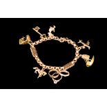 A 9CT ROSE GOLD CHARM BRACELET,