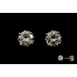 A PAIR OF DIAMOND SOLITAIRE EARRINGS, of approx. 0.